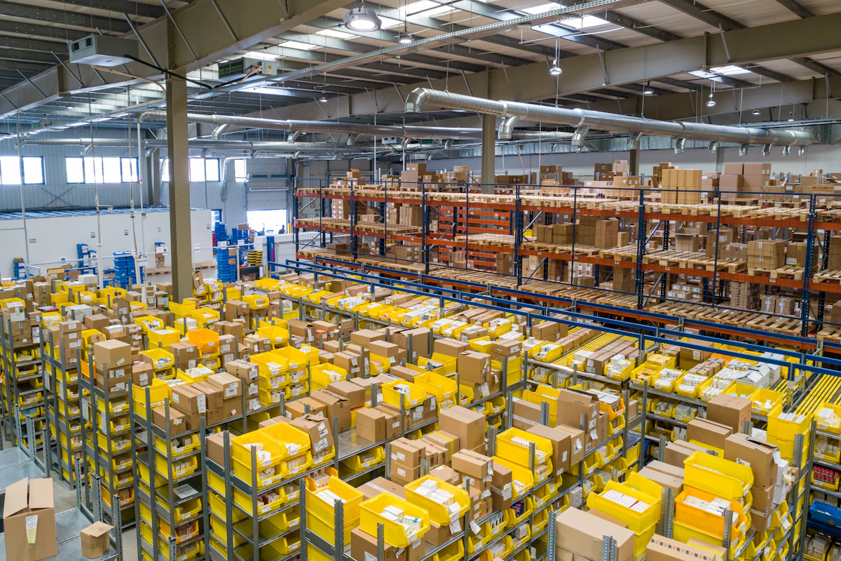 Warehouse worker counting inventory on a clipboard